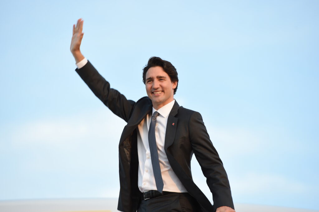 Canadian Prime Minister Justin Trudeau waves goodbye as he boards his plane at Joint Base Andrews, Md., March 11, 2016. Trudeau leaves after completing a three-day state visit with U.S. President Barack Obama to strengthen U.S.-Canada relations. (U.S. Air Force photo by Senior Airman Joshua R. M. Dewberry/RELEASED)